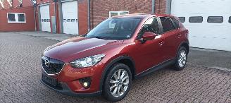 Mazda CX-5 4WD Diesel Navigatie Xenon Leder Bose-sound Climatecontrol CruiseControl Stoelverwarming Lichtautomaat Privacyglas keyless Entry trekhaak Parkeersensoren Achteruitrijcamera 2014/7