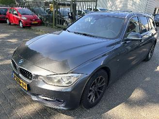 Damaged car BMW 3-serie 320i  Touring High Executive  Automaat 2014/11